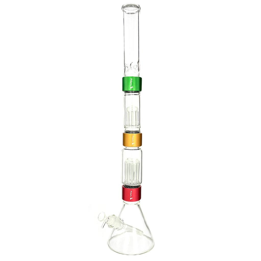Vertical studio shot of the Prism Water Pipes Rasta Beaker Triple Stack showing three colored bands (green, gold, red) separating clear glass percolator chambers.