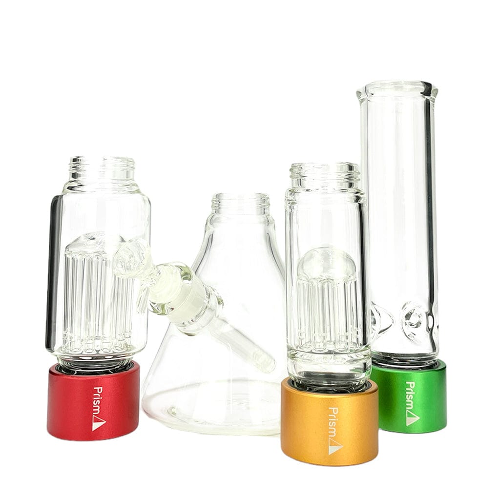 Front view of three clear glass pieces stacked on red, gold, and green bases alongside a central conical chamber in the Prism Water Pipes Rasta Beaker Triple Stack.