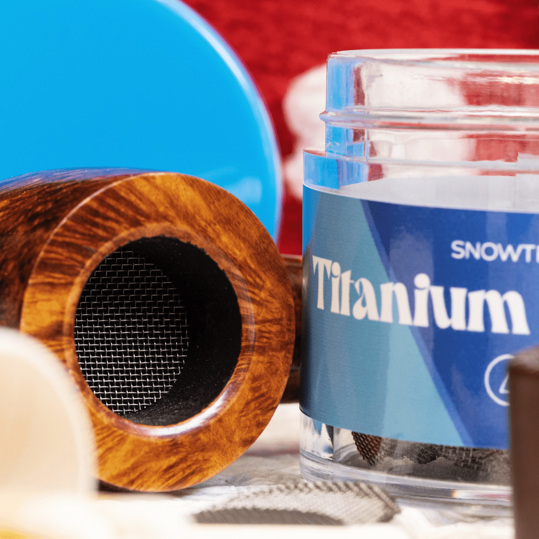 Close-up of Pure Titanium Mesh Screens next to a blue, labeled container, angled against a dark backdrop.