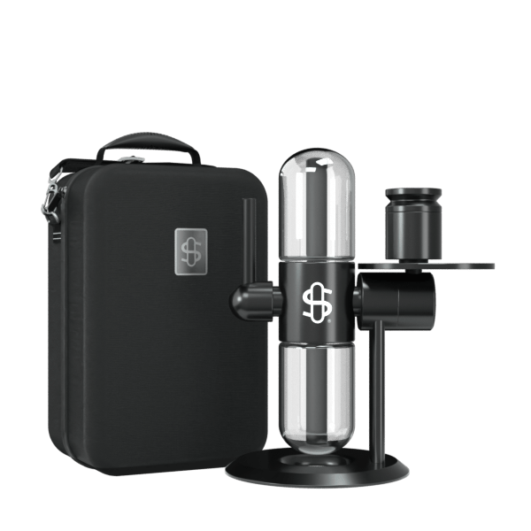 A front view of the Stündenglass Kompact Gravity Infuser on a dark surface, showcasing its cylindrical glass form and sleek black base.